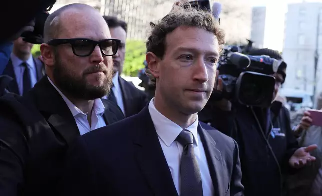 Meta CEO Mark Zuckerberg arrives for a landmark trial over whether social media platforms deliberately addict and harm children, Wednesday, Feb. 18, 2026, in Los Angeles. (AP Photo/Ryan Sun)