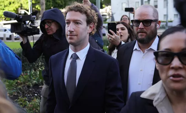 Meta CEO Mark Zuckerberg arrives for a landmark trial over whether social media platforms deliberately addict and harm children, Wednesday, Feb. 18, 2026, in Los Angeles. (AP Photo/Ryan Sun)