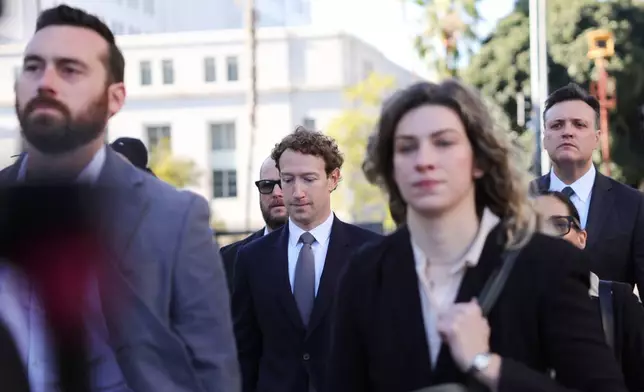 Meta CEO Mark Zuckerberg arrives for a landmark trial over whether social media platforms deliberately addict and harm children, Wednesday, Feb. 18, 2026, in Los Angeles. (AP Photo/Ryan Sun)