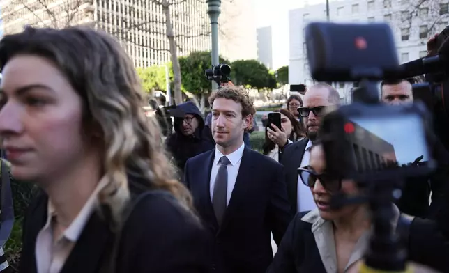 Meta CEO Mark Zuckerberg arrives for a landmark trial over whether social media platforms deliberately addict and harm children, Wednesday, Feb. 18, 2026, in Los Angeles. (AP Photo/Ryan Sun)