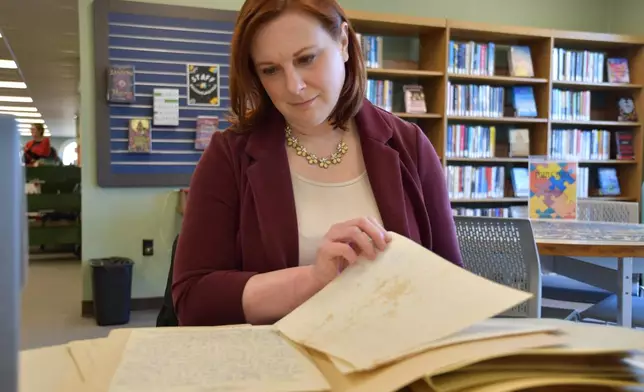 Archivist Kelley Sirko looks at love letters between a Black soldier and his wife during World War II that are part of a digital exhibit on Monday, Feb. 9, 2026 in Nashville, Tenn. (AP Photo/Kristin M. Hall)