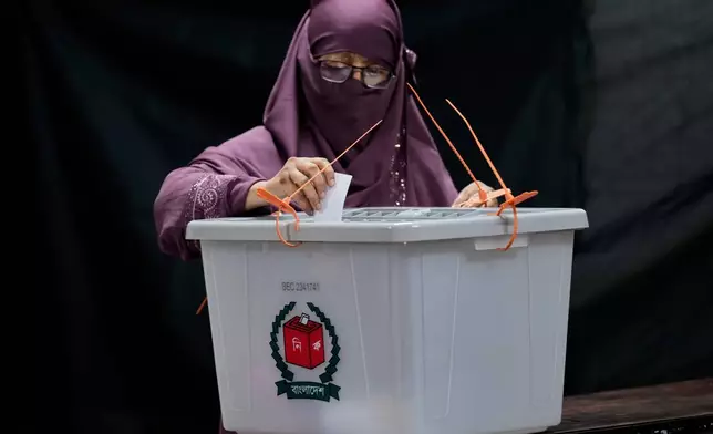 A Bangladeshi woman casts her vote in a polling station during national parliamentary election in Dhaka, Bangladesh, Thursday, Feb. 12, 2026. (AP Photo/Anupam Nath)