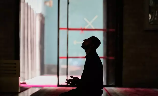 A Muslim prays during a prayer at Baitul Mukarram National Mosque ahead of Thursday's national parliamentary election, in Dhaka, Bangladesh, Wednesday, Feb. 11, 2026. (AP Photo/Anupam Nath)