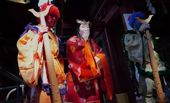Locals dressed as Japanese folklore figures participate in the annual Bean Throwing Festival in Hakone, Japan, Tuesday, Feb. 3, 2026. (AP Photo/Eugene Hoshiko)
