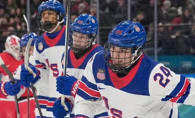 United States' Joy Dunne, right, celebrates after scoring her side's second goal during a preliminary round match of women's ice hockey between Switzerland and United States at the 2026 Winter Olympics, in Milan, Italy, Monday, Feb. 9, 2026. (AP Photo/Hassan Ammar)