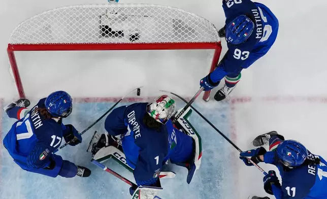 Japan's Akane Shiga scores her side's second goal during a preliminary round match of women's ice hockey between Japan and Italy at the 2026 Winter Olympics, in Milan, Italy, Monday, Feb. 9, 2026. (AP Photo/Hassan Ammar)