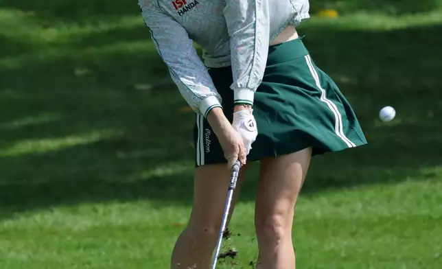 Charley Hull of England plays a shot during the HSBC World Championship of women's golf at Sentosa Golf Club in Singapore, Thursday, Feb. 26, 2026. (AP Photo/Suhaimi Abdullah)