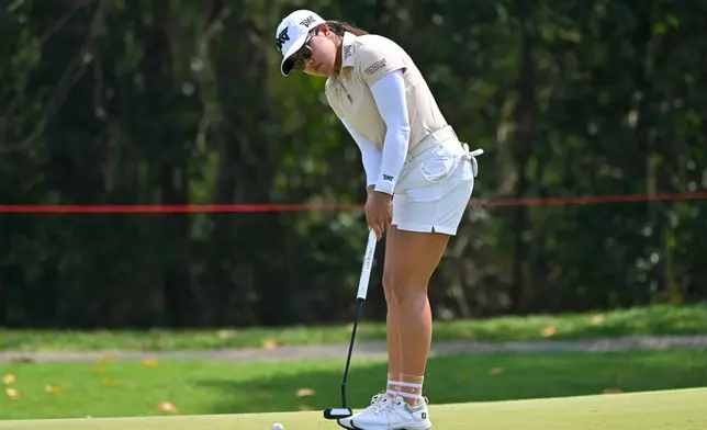 Auston Kim of the United States makes a putt shot on the 13th hole during the first round of the LPGA Honda Thailand golf tournament in Pattaya, Thailand, Thursday, Feb. 19, 2026. (AP Photo/Kittinun Rodsupan)