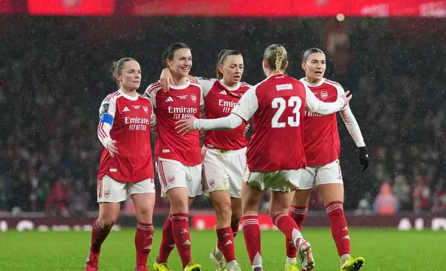 Arsenal's Lotte Wubben-Moy, 2nd left, celebrates after scoring her side's second goal during the Women's Champions Cup final soccer match between Arsenal FC and SC Corinthians in London, Sunday, Feb. 1, 2026. (AP Photo/Alastair Grant)