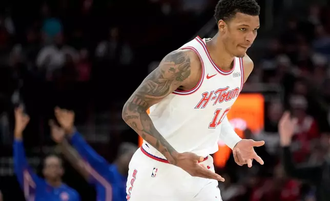 Houston Rockets forward Jabari Smith Jr. reacts after making a three point basket against the Dallas Mavericks during the first half of an NBA basketball game Saturday, Jan. 31, 2026, in Houston. (AP Photo/Eric Christian Smith)