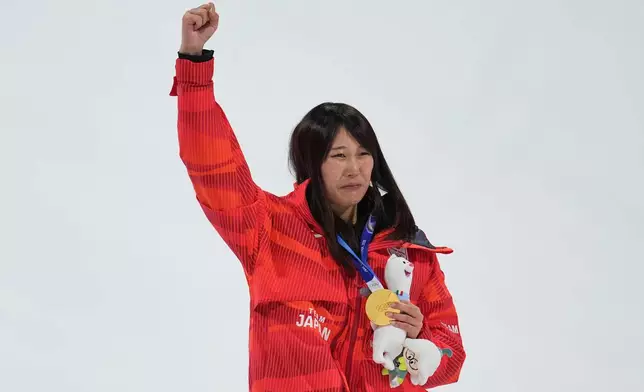 Gold medalist Japan's Kokomo Murase celebrates winning the women's snowboarding big air finals at the 2026 Winter Olympics, in Livigno, Italy, Monday, Feb. 9, 2026. (AP Photo/Abbie Parr)
