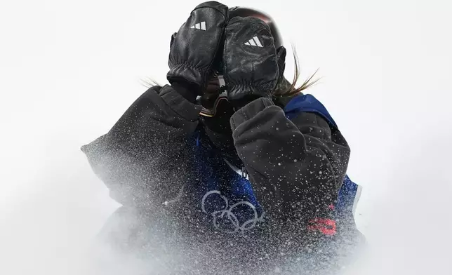 Britain's Mia Brookes reacts during the women's snowboarding big air finals at the 2026 Winter Olympics, in Livigno, Italy, Monday, Feb. 9, 2026. (AP Photo/Lindsey Wasson)