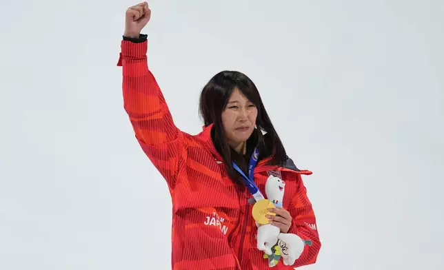 Gold medalist Japan's Kokomo Murase celebrates winning the women's snowboarding big air finals at the 2026 Winter Olympics, in Livigno, Italy, Monday, Feb. 9, 2026. (AP Photo/Abbie Parr)