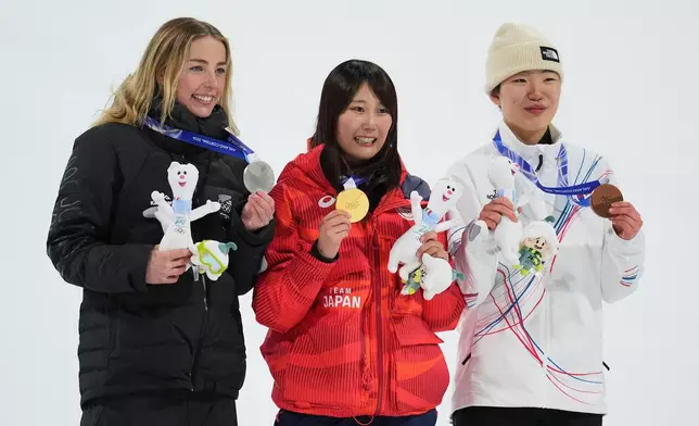 From left, silver medalist New Zealand's Zoi Sadowski-Synnott, gold medalist Japan's Kokomo Murase and bronze medalist South Korea's Yu Seung-eun hold their medals after the women's snowboarding big air finals at the 2026 Winter Olympics, in Livigno, Italy, Monday, Feb. 9, 2026. (AP Photo/Abbie Parr)