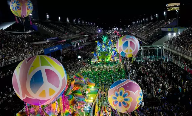Performers from the Mocidade samba school parade during Carnival celebrations at the Sambadrome in Rio de Janeiro, late Monday, Feb. 16, 2026. (AP Photo/Bruna Prado)