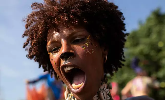 A reveler performs during the Amigos da Onca Carnival street party in Rio de Janeiro, Saturday, Feb. 14, 2026. (AP Photo/Bruna Prado)