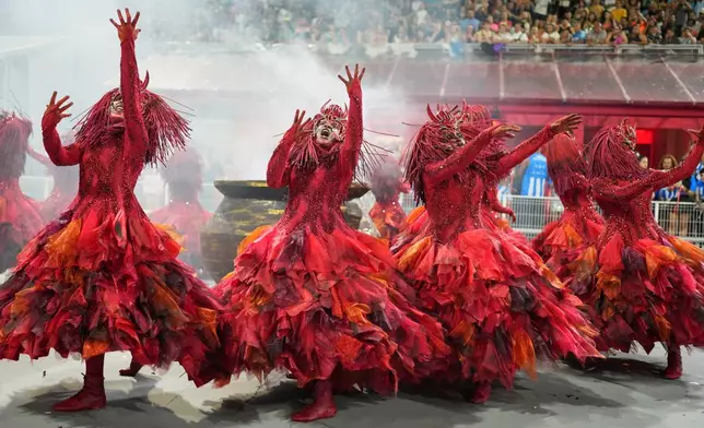 Dancers from the Colorado do Bras samba school perform during a carnival parade in Sao Paulo, Saturday, Feb. 14, 2026. (AP Photo/Andre Penner)