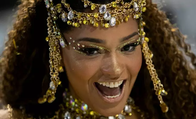 A performer from the Unidos da Tijuca samba school parades during Carnival celebrations at the Sambadrome in Rio de Janeiro, early Tuesday, Feb. 17, 2026. (AP Photo/Bruna Prado)