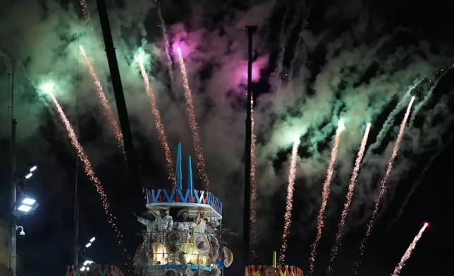 Performers from the Mangueira samba school parade on a float during Carnival celebrations at the Sambadrome in Rio de Janeiro, Monday, Feb. 16, 2026. (AP Photo/Silvia Izquierdo)