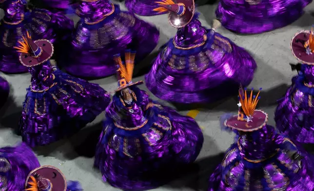 Performers from the Mocidade samba school parade during Carnival celebrations at the Sambadrome in Rio de Janeiro, Monday, Feb. 16, 2026. (AP Photo/Bruna Prado)