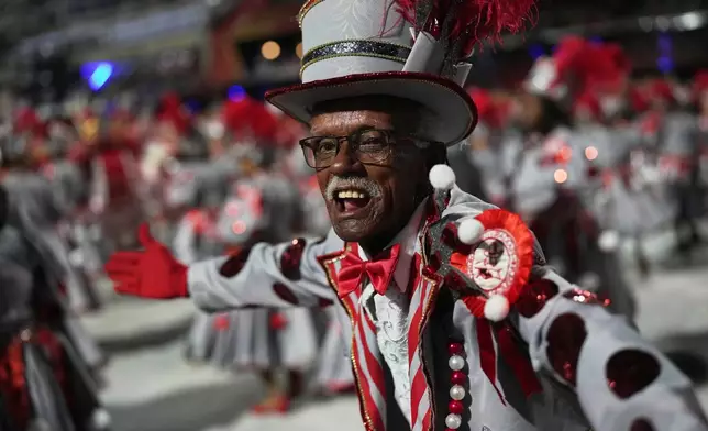 A performer from the Viradouro samba school parades during Carnival celebrations at the Sambadrome, in Rio de Janeiro, Tuesday, Feb. 17, 2026. (AP Photo/Silvia Izquierdo)
