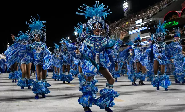 Performers from the Portela samba school parade during Carnival celebrations at the Sambadrome in Rio de Janeiro, early Monday, Feb. 16, 2026. (AP Photo/Bruna Prado)