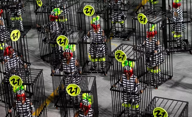 Performers from the Mocidade samba school parade during Carnival celebrations at the Sambadrome in Rio de Janeiro, Monday, Feb. 16, 2026. (AP Photo/Bruna Prado)