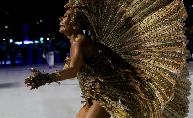 Former model and actress Adriane Galisteu parades at the Portela samba school during Carnival celebrations at the Sambadrome in Rio de Janeiro, early Monday, Feb. 16, 2026. (AP Photo/Bruna Prado)