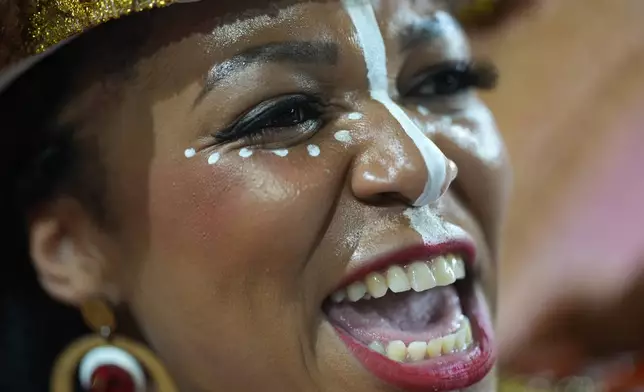 A dancer from the Mocidade Unida da Mooca samba school performs during a carnival parade in Sao Paulo, Friday, Feb. 13, 2026. (AP Photo/Andre Penner)
