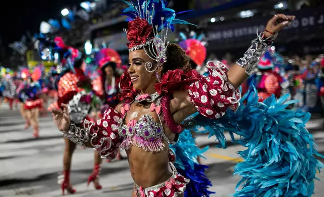 A performer from the Vila Isabel samba school parades during Carnival celebrations at the Sambadrome in Rio de Janeiro, early Wednesday, Feb. 18, 2026. (AP Photo/Bruna Prado)