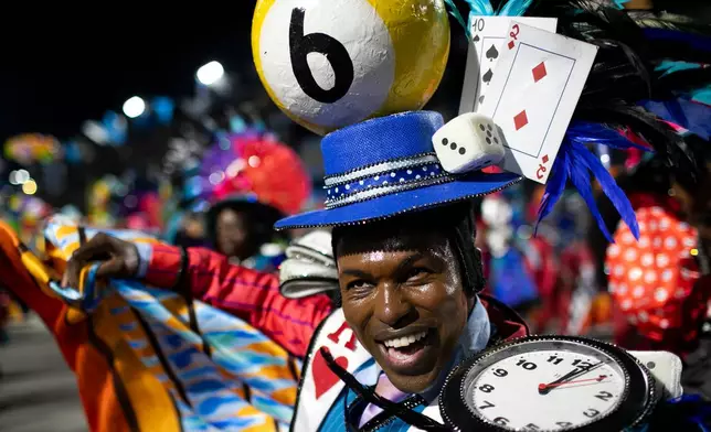 A performer from the Vila Isabel samba school parades during Carnival celebrations at the Sambadrome in Rio de Janeiro, early Wednesday, Feb. 18, 2026. (AP Photo/Bruna Prado)