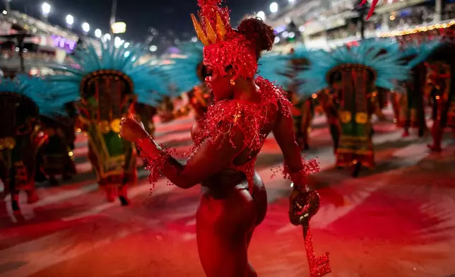A performer from the Portela samba school parades during Carnival celebrations at the Sambadrome in Rio de Janeiro, early Monday, Feb. 16, 2026. (AP Photo/Bruna Prado)