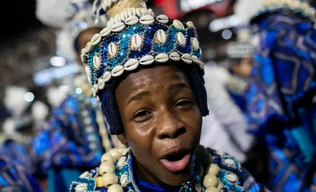Performer from the Portela samba school parades during Carnival celebrations at the Sambadrome in Rio de Janeiro, early Monday, Feb. 16, 2026. (AP Photo/Bruna Prado)