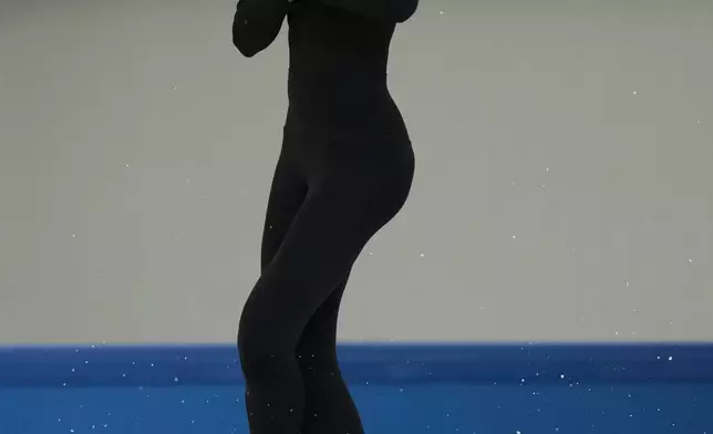 Individual Neutral Athlete Adeliia Petrosian performs during a figure skating practice session at the 2026 Winter Olympics, in Milan, Italy, Monday, Feb. 16, 2026. (AP Photo/Stephanie Scarbrough)