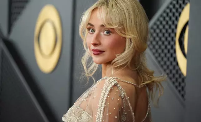 Sabrina Carpenter arrives at the 68th annual Grammy Awards on Sunday, Feb. 1, 2026, in Los Angeles. (Photo by Jordan Strauss/Invision/AP)