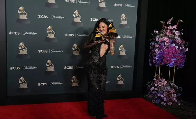 Kehlani poses in the press room with the awards for best R&amp;B performance and best R&amp;B song for "Folded" during the 68th annual Grammy Awards on Sunday, Feb. 1, 2026, in Los Angeles. (Photo by Richard Shotwell/Invision/AP)