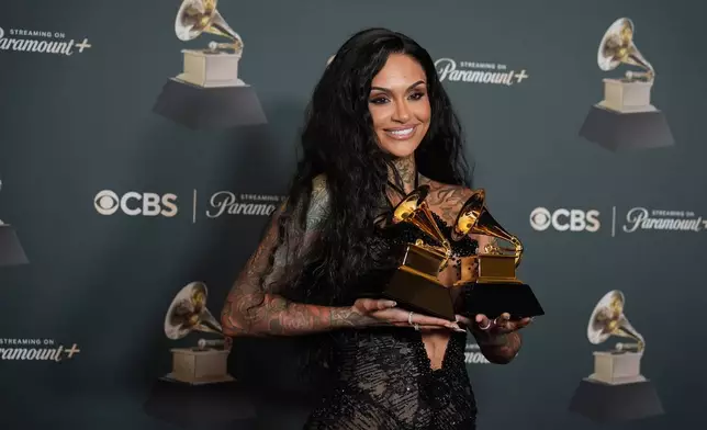 Kehlani poses in the press room with the awards for best R&amp;B performance and best R&amp;B song for "Folded" during the 68th annual Grammy Awards on Sunday, Feb. 1, 2026, in Los Angeles. (Photo by Richard Shotwell/Invision/AP)
