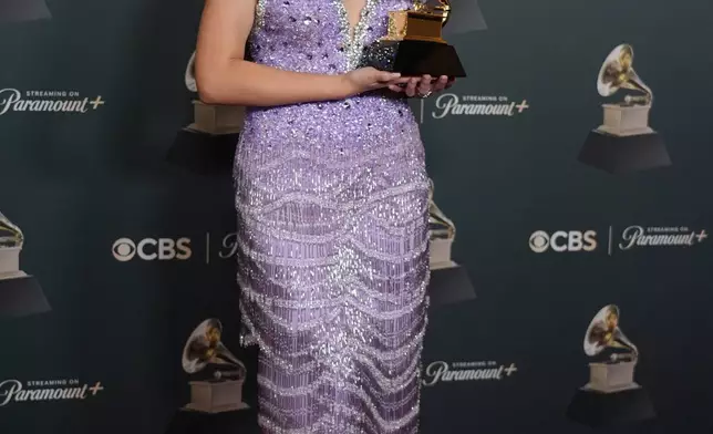 Laufey poses in the press room with the award for best traditional pop vocal album for "A Matter of Time"during the 68th annual Grammy Awards on Sunday, Feb. 1, 2026, in Los Angeles. (Photo by Richard Shotwell/Invision/AP)