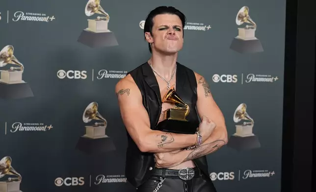 Yungblud poses in the press room with the award for best rock performance for "Changes (Live From Villa Park) Back To The Beginning" during the 68th annual Grammy Awards on Sunday, Feb. 1, 2026, in Los Angeles. (Photo by Richard Shotwell/Invision/AP)