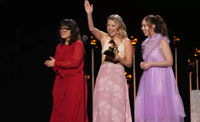Sara Watkins, from left, Aoife O'Donovan, and Sarah Jarosz of I'm With Her accept the award for best folk album for "Wild and Clear and Blue" during the 68th annual Grammy Awards on Sunday, Feb. 1, 2026, in Los Angeles. (AP Photo/Chris Pizzello)