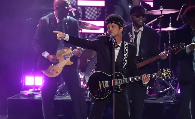Bruno Mars performs "APT." during the 68th annual Grammy Awards on Sunday, Feb. 1, 2026, in Los Angeles. (AP Photo/Chris Pizzello)