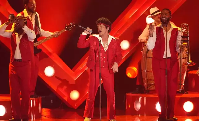 Bruno Mars performs "I Just Might" during the 68th annual Grammy Awards on Sunday, Feb. 1, 2026, in Los Angeles. (AP Photo/Chris Pizzello)