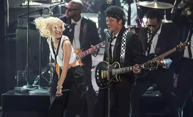 Rose, left, and Bruno Mars perfom "APT." during the 68th annual Grammy Awards on Sunday, Feb. 1, 2026, in Los Angeles. (AP Photo/Chris Pizzello)