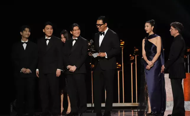 The team from KPop Demon Hunters accept the award for best song written for visual media for "Golden" during the 68th annual Grammy Awards on Sunday, Feb. 1, 2026, in Los Angeles. (AP Photo/Chris Pizzello)
