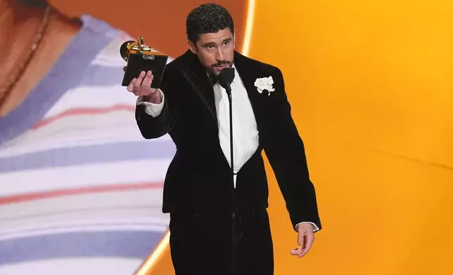 Bad Bunny accepts the award for album of the year for "Debí Tirar Más Fotos" during the 68th annual Grammy Awards on Sunday, Feb. 1, 2026, in Los Angeles. (AP Photo/Chris Pizzello)
