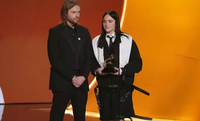Finneas, left, and Billie Eilish accept the award for song of the year for "Wildflower" during the 68th annual Grammy Awards on Sunday, Feb. 1, 2026, in Los Angeles. (AP Photo/Chris Pizzello)