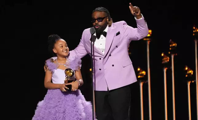 Aura V, left, and Fyutch accept the award for best children's music album for "Harmony" during the 68th annual Grammy Awards on Sunday, Feb. 1, 2026, in Los Angeles. (AP Photo/Chris Pizzello)