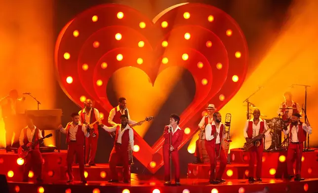 Bruno Mars performs "I Just Might" during the 68th annual Grammy Awards on Sunday, Feb. 1, 2026, in Los Angeles. (AP Photo/Chris Pizzello)