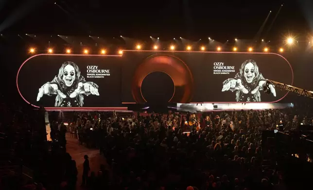Brandy Clark, from left, Reba McEntire, and Lukas Nelson perform "Trailblazer" as an in memoriam tribute with an image of Ozzy Osbourne on the screen during the 68th annual Grammy Awards on Sunday, Feb. 1, 2026, in Los Angeles. (AP Photo/Chris Pizzello)