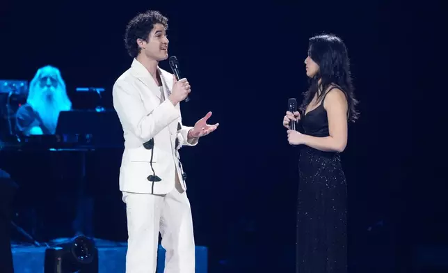 Darren Criss, left, and Helen J. Shen perform "Never Fly Away" during the 68th annual Grammy Awards on Sunday, Feb. 1, 2026, in Los Angeles. (AP Photo/Chris Pizzello)